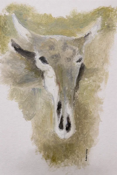 A horned skull-like form painted in muted greys and ochres